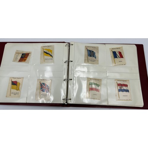 919 - An album containing 132 cigarette silks to include 29 x Kensitas, plus BDV etc. - Heraldic, Colonial... 