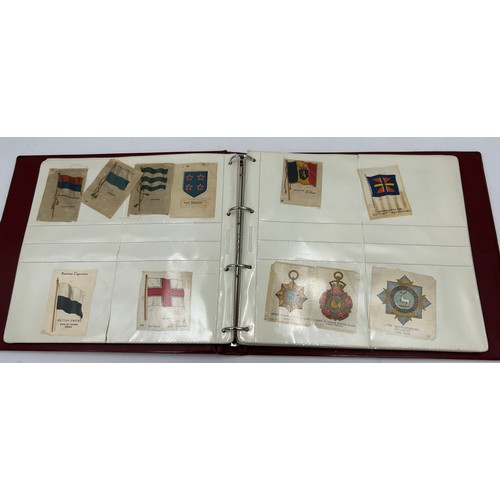 919 - An album containing 132 cigarette silks to include 29 x Kensitas, plus BDV etc. - Heraldic, Colonial... 