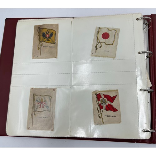 919 - An album containing 132 cigarette silks to include 29 x Kensitas, plus BDV etc. - Heraldic, Colonial... 