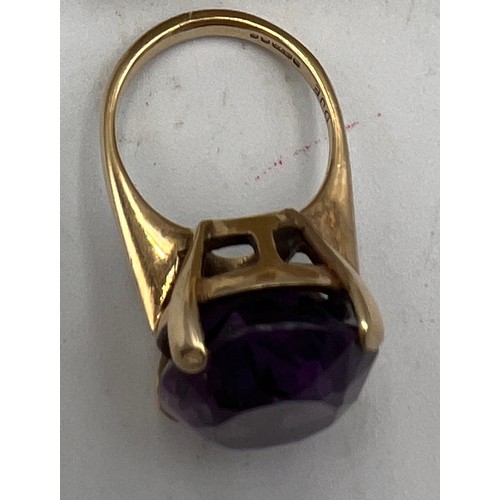 586 - A nine carat gold ring set with amethyst. Size L. weight 8.5gm.