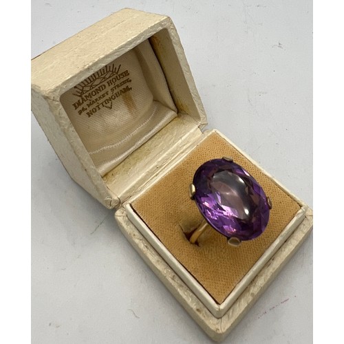 586 - A nine carat gold ring set with amethyst. Size L. weight 8.5gm.