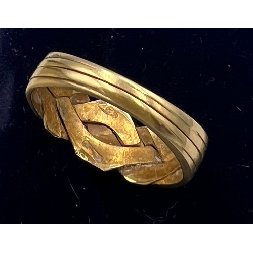 591 - A yellow metal ring with marks rubbed. Size M. Weight 3.5gm.