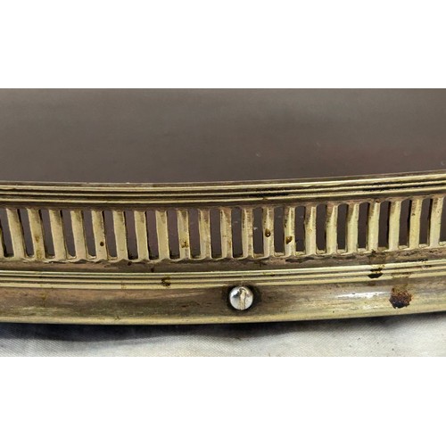 1340 - A 20thC oval raised mahogany tray, base inlaid with a shell, with silver plated galleried edge marke... 