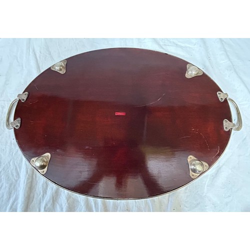 1340 - A 20thC oval raised mahogany tray, base inlaid with a shell, with silver plated galleried edge marke... 