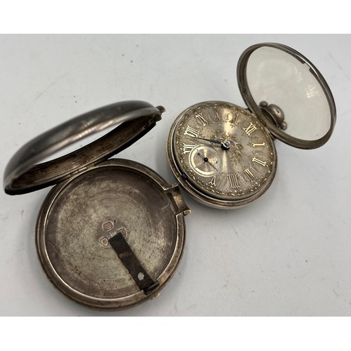 700 - A silver pair cased pocket watch London 1883 with subsidiary seconds dial. Total weight 148.5gm. 6cm... 