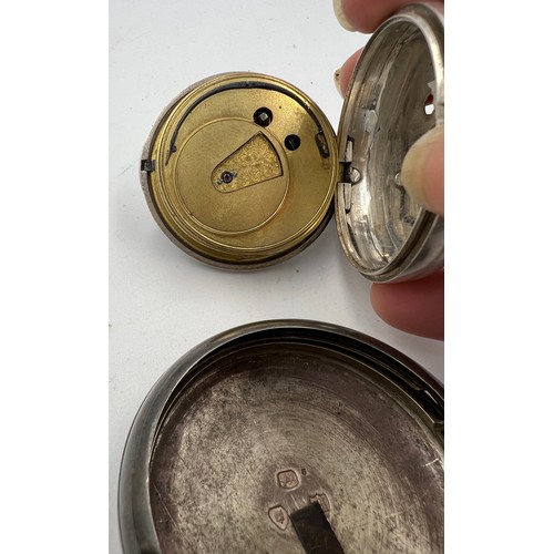 700 - A silver pair cased pocket watch London 1883 with subsidiary seconds dial. Total weight 148.5gm. 6cm... 