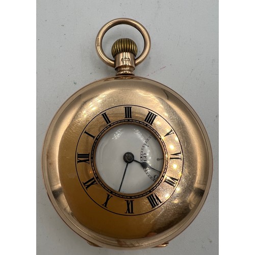 701 - A nine carat gold half hunter pocket watch with subsidiary seconds dial. Total weight 98.4gm. 5cm d.