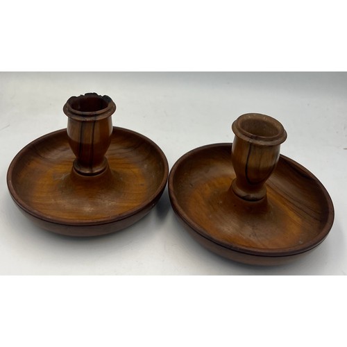 144 - A pair of 19thC walnut treen ‘Brighton Bun’ travelling portable dwarf candlesticks. 10.5cm diameter.