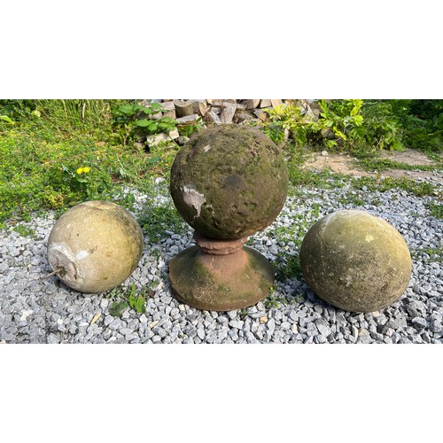 221 - An early hand hewn stone petrosphere, diameter 24cm, height 40cm on integral stand together with a p... 