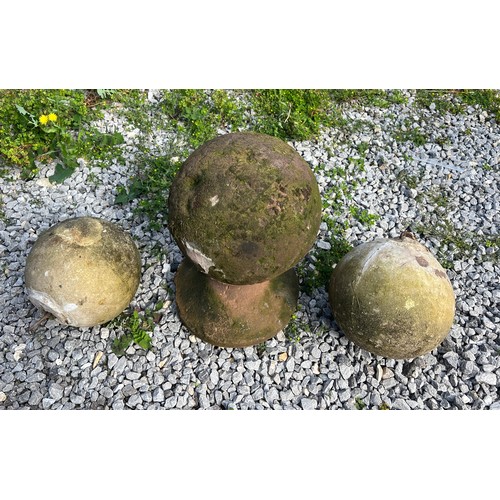 221 - An early hand hewn stone petrosphere, diameter 24cm, height 40cm on integral stand together with a p... 