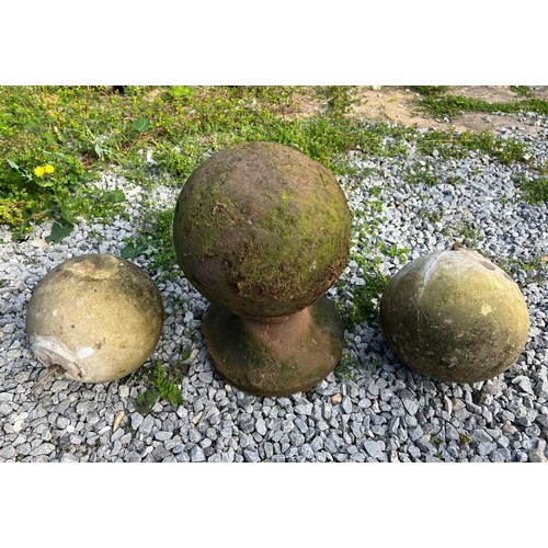 221 - An early hand hewn stone petrosphere, diameter 24cm, height 40cm on integral stand together with a p... 