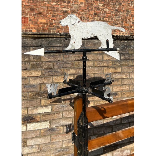 175 - A metal weather vane with dog to the top. Height approximately  76cm.