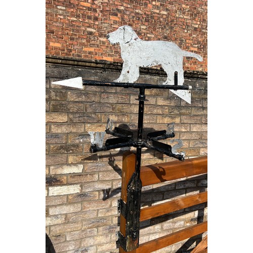 175 - A metal weather vane with dog to the top. Height approximately  76cm.