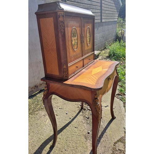 137 - French style desk with inlaid and painted decoration on cabriole legs with gilt metal mounts. 133cm ... 