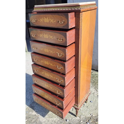 138 - A French style chest of eight drawers with floral inlay and marble top. 129cm h x 51cm w x 32cm d.