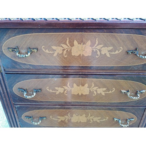 138 - A French style chest of eight drawers with floral inlay and marble top. 129cm h x 51cm w x 32cm d.