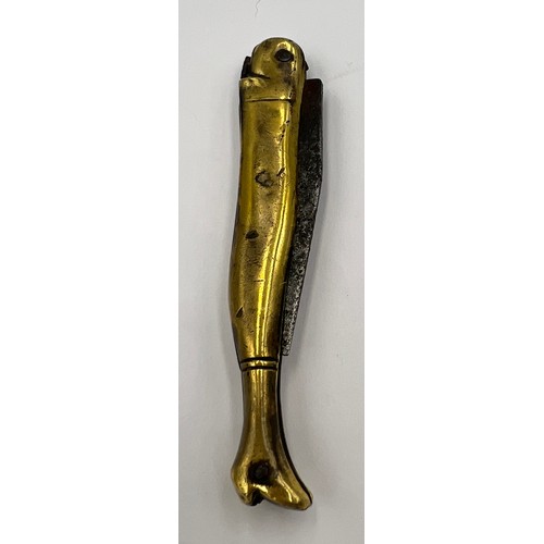 210 - A Georgian brass cased pocket knife in the form of a ladies leg in a heeled boot with a forged steel... 