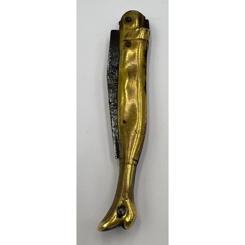 210 - A Georgian brass cased pocket knife in the form of a ladies leg in a heeled boot with a forged steel... 