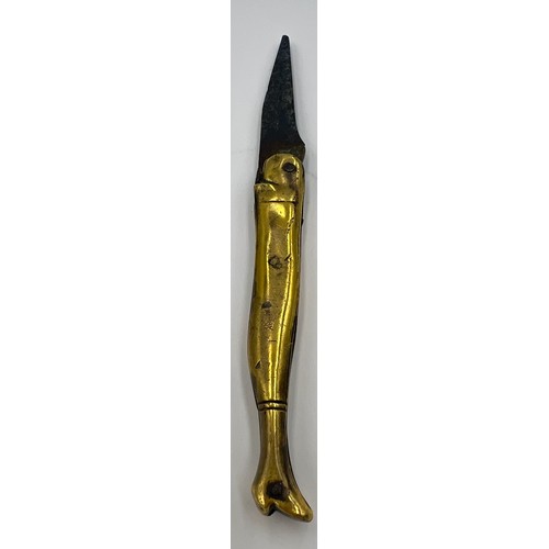 210 - A Georgian brass cased pocket knife in the form of a ladies leg in a heeled boot with a forged steel... 