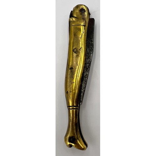 210 - A Georgian brass cased pocket knife in the form of a ladies leg in a heeled boot with a forged steel... 