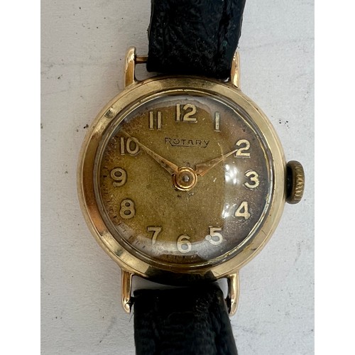 714A - A 9 carat gold cased ladies Rotary wristwatch on black leather strap. Total weight 10.4gm.