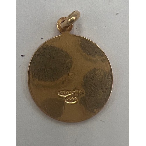 616A - An 18 carat gold Taurus charm. Weight 3.5gm. Size 16mm d.