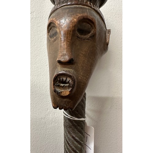 921 - An African stick with carved head and metal covered shaft, circa 1940’s, brought back to England dur... 