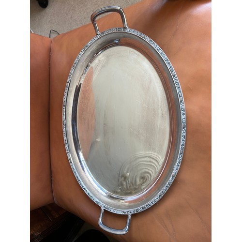 753 - A large quantity of good quality silverplated items to include a large footed tray by Walker and Hal... 