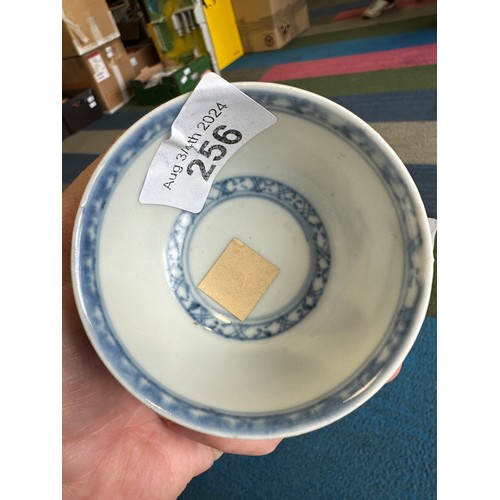 256 - A 18thC Nanking Cargo tea bowl 4cm h and saucer 11.7cm d  with underglaze blue painted decoration of... 