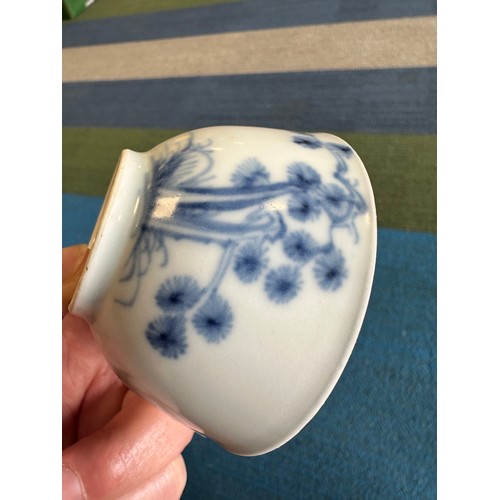 256 - A 18thC Nanking Cargo tea bowl 4cm h and saucer 11.7cm d  with underglaze blue painted decoration of... 