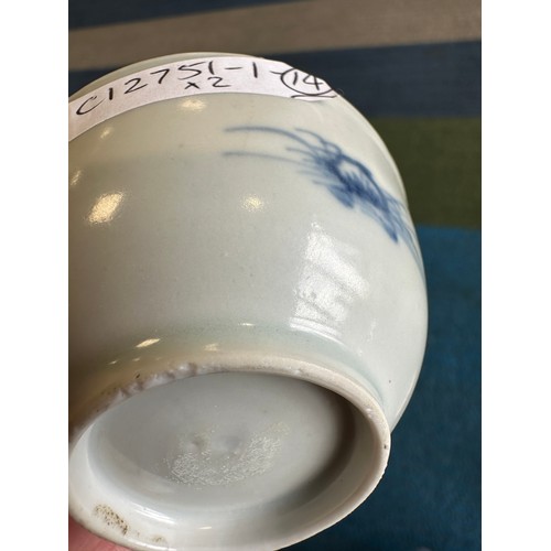 256 - A 18thC Nanking Cargo tea bowl 4cm h and saucer 11.7cm d  with underglaze blue painted decoration of... 