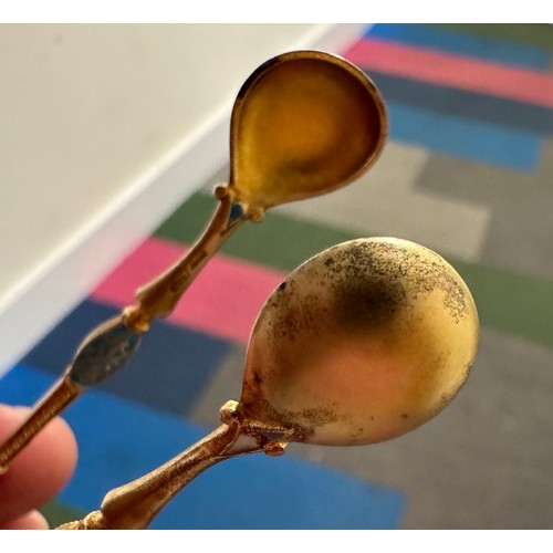 754 - Norwegian white metal and gilt enamel spoons and tongs. Weight 66gm.