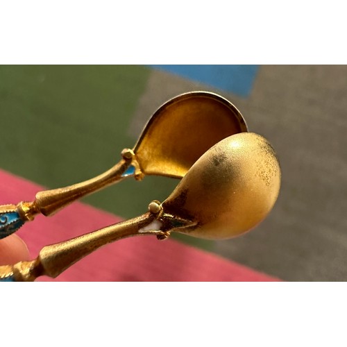 754 - Norwegian white metal and gilt enamel spoons and tongs. Weight 66gm.