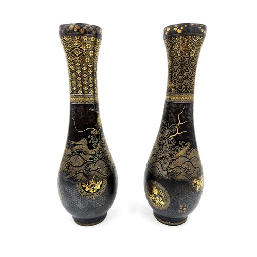 Pair of Japanese Damascened iron vases from Komai of Kyoto, both signed in gold to base areas. 31cm h.