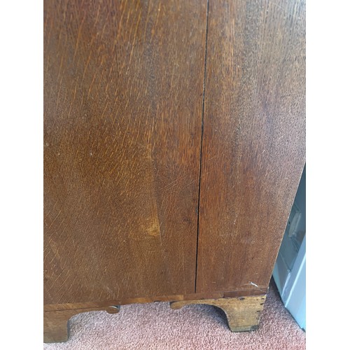 33 - An early 19thC oak bureau with brass handles and bracket feet. 94cm w x 107cm h x 49cm d.