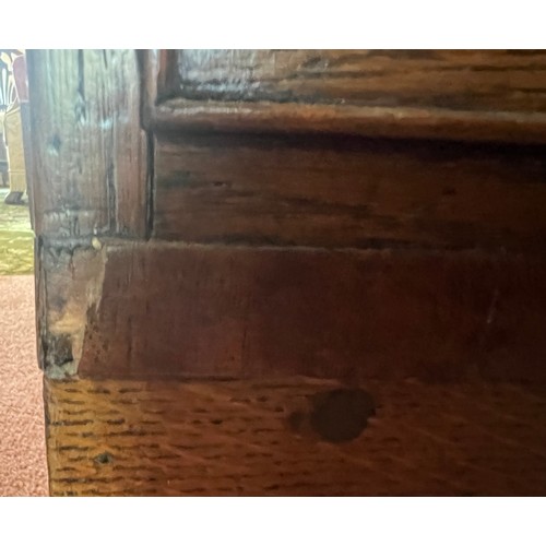 33 - An early 19thC oak bureau with brass handles and bracket feet. 94cm w x 107cm h x 49cm d.