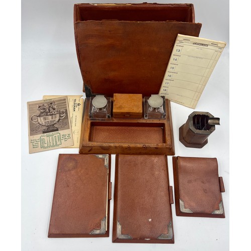 1403 - A quantity of Asprey silver and leather desk items to include stationary box, notebooks, ashtray, in... 