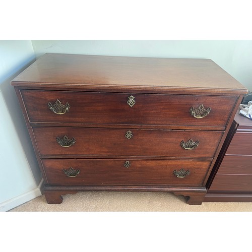 39 - A 19thC mahogany chest of three long drawers with brass handles. 109cm w x 51cm d x 89cm h.