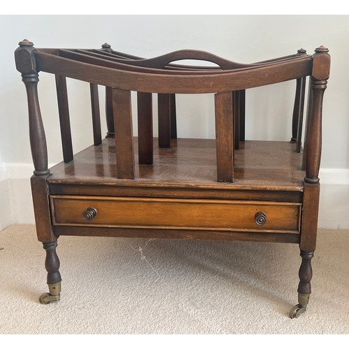 43 - A mahogany Canterbury on brass castors with drawer to front. 50cm w x 36cm d x 47cm h.