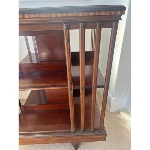 46 - An Edwardian mahogany inlaid revolving bookcase. 59cm x 59cm x 91cm h.