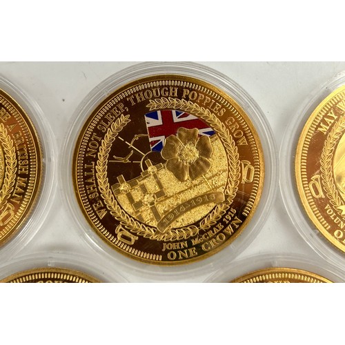 779 - A large quantity of gold plated proof coins/medallions to include 5 x 2014 WW1 Centenary, 4 x one do... 