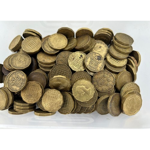 780 - A large quantity of sixpences dated 1948 -1967 along with a quantity of brass threepence pieces.