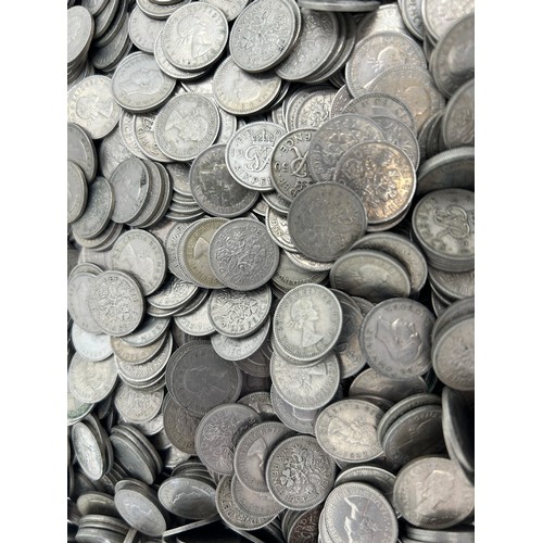 780 - A large quantity of sixpences dated 1948 -1967 along with a quantity of brass threepence pieces.