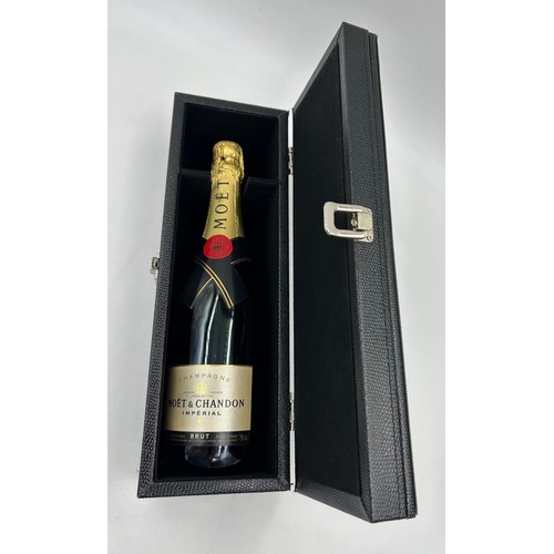 1250 - Presentation case containing a bottle of Moet & Chandon Imperial Champagne 750ml along with accessor... 