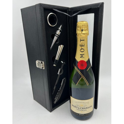 1250 - Presentation case containing a bottle of Moet & Chandon Imperial Champagne 750ml along with accessor... 