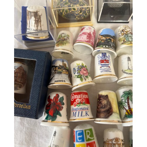 450 - A collection 178 Thimbles to include one silver Birmingham M.Kamin & Co 1983, 3 x Wedgwood, 5 x Roya... 