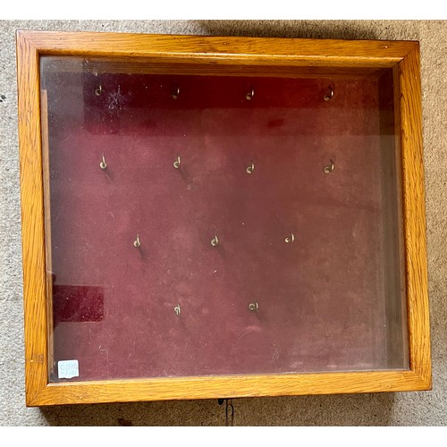 1412 - An oak table top display case with hooks to interior. 39.5cm x 45cm.