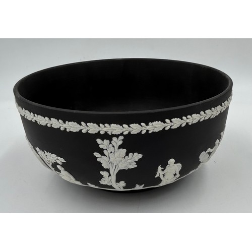 396 - Two Black Wedgwood Jasperware bowls, footed 13cm h x 19.5cm d and the other 9cm h x 19.5cm d along w... 