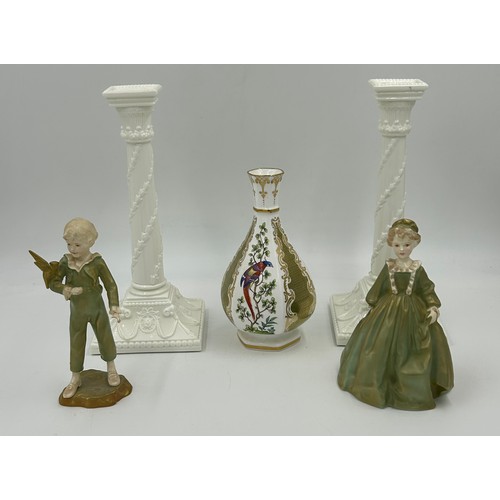 397 - A pair of Royal Worcester porcelain candle sticks green marked to base 27cm high, together with a pa... 