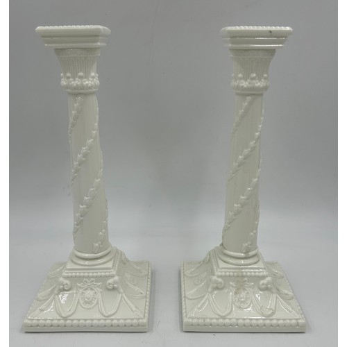 397 - A pair of Royal Worcester porcelain candle sticks green marked to base 27cm high, together with a pa... 